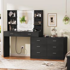 a black desk with drawers and a mirror on it