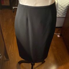 Dana Buchman Skirt. Size 8. The Skirt Was Never Worn And Is Not Hemmed. This Is A Very Expensive Skirt As You Can See The Tag Is Attached With A Price Of $168.00. There Is A Kick Pleat In The Back. Nice. Fitting Skirt. Formal Stretch Lined Skirt, Formal Fitted Skirted Skort, Fitted Skirted Skort For Formal Occasions, Classic Long Stretch Skirt, Elegant Knee-length Solid Skort, Formal Lined Skort, Formal Mini Skirt With Relaxed Fit And Lining, Formal Stretch Mini Skirt, Elegant Black Pencil Skirt Shaped Skort