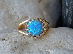 "Opal Gold Ring, Gemstone ring, Blue Opal Ring, October Birthstone,Opal blue Gold Filled Ring,Ocean Opal jewelry,Turquoise Opal Feminine Ring It will be a perfect gift for women. It is made of gold filled 14k and Opal. Measurements: Size- all The center stone is 10mm Please select in the \"type box\". The ring will be packed in a gift box. FOR MY RINGS COLLECTION HERE: https://www.etsy.com/il-en/shop/rebekajewelry?section_id=14282915&ref=shopsection_leftnav_9 TO GET TO MY SHOP: https://www.e Blue Oval Cabochon Opal Ring, Opal Gold Ring, Blue Opal Ring, Opal Ring Gold, Fire Opal Ring, Rings Collection, Jewelry Turquoise, Gold Filled Ring, Ring Blue