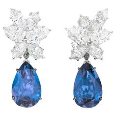 Elevate your jewelry collection with a pair of truly exceptional earrings meticulously crafted to fulfill the distinct preferences of our esteemed client, Louis. These bespoke earrings feature a dazzling duo of 6 Carat Vivid Blue Pear Shape Sapphires, sourced from the enchanting landscapes of Sri Lanka. Luxury Sapphire Earrings Fine Jewelry, Luxury Blue Pear-shaped Earrings, Luxury Pear-shaped Gemstone Diamond Earrings, Luxury Pear-shaped Diamond Earrings With Gemstones, Luxury Gia Certified Pear-shaped Diamond Earrings, Luxury Pear-shaped Cluster Earrings With Brilliant Cut, Luxury Pear-shaped Cluster Earrings For Formal Events, Luxury Pear-shaped Cluster Earrings For Formal Occasions, Luxury Pear-shaped Diamond Earrings