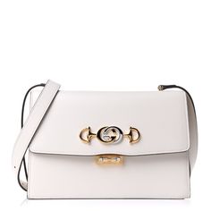 Authentic New Gucci Small Gg Zumi Leather Shoulder Bag Color: Mystic White Made In Italy New With Tags Details: Top Flap With Clasp Closure. Silver Gold-Toned Metal Hardware With Adjustable Strap For Shoulder Or Crossbody Wear. 3 Compartments And A Zip Pocket. Size: 9.5" X 6.5" X 2.5" Elegant Evening Bag With Horsebit Detail, Elegant Gold Shoulder Bag With Horsebit Detail, Elegant Rectangular Shoulder Bag With Horsebit Detail, White Gucci Shoulder Bag For Evening, White Gucci Bag For Formal Occasions, White Gucci Bag For Everyday Luxury, Elegant Shoulder Bag With Horsebit Detail, Elegant Gucci Bag With Horsebit Detail, Gucci Leather Bag