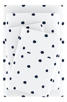 four white sheets with black dots on them