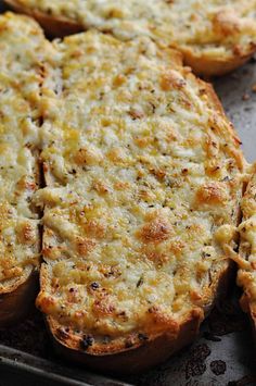 baked cheese toast on a baking sheet with text overlay that reads garlicky cheese toast