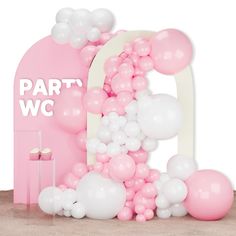 pink and white balloons are in front of a sign that says party w c on it