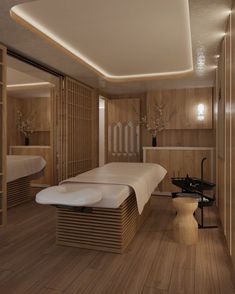 a spa room with two massage tables and wooden walls in the background, along with shelves on both sides