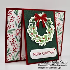 two christmas cards, one with a wreath and the other with holly berries on it