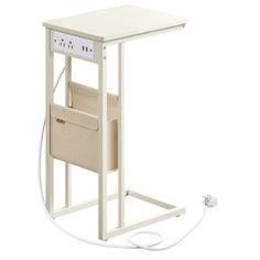 a white table with an electrical outlet on the side and a beige basket under it