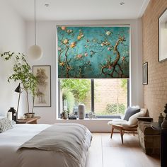 a bedroom with a large window covered in blue and pink flowers next to a bed