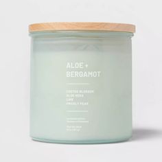 an aloe + bergamot candle on a white background