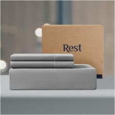 the rest bedding set is in front of a box with its logo on it