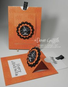 two orange cards with black and white paper on them, one has a pumpkin design