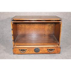 an old fashioned wooden box with two drawers