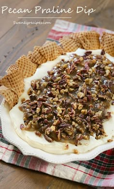 pecan pralie dip on a plate with waffles