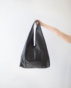 "Please read our shipping terms and conditions before placing an order : https://www.etsy.com/listing/1079992551/must-read-alus-indonesia-shipping-terms This TRIA is an unlined hobo bag in triangle shape made from soft calf skin/ cow leather. This is a bag that holds your shoulder effortlessly and can take all your necessary everyday items. From weekend, to weekday, this roomy bag goes with many outfits and occasions. Not many color option available for the soft calf skin/ cow leather. If you wa Soft Leather Hobo Bag, Large Hobo Bag, Cow Skin, Hobo Bags, Large Shoulder Bags, Black Shoulder Bag, Leather Hobo Bag, Boho Bag, Calf Hair