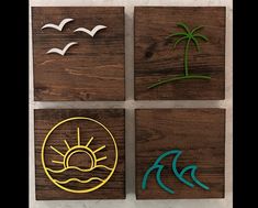 four wooden coasters with seagulls, palm trees and the sun on them