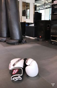 two boxing gloves are laying on the floor