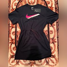 Brand: Nike Nwt, Never Worn Nike Logo Colors: Black, Pink, And White Front Drawstring At Waist Nike Summer Dresses, Sporty Black Summer Dress, Sporty Black Mini Dress, Sporty Black Spring Dress, Sporty Black Dress For Spring, Vintage Tees Women, Womens Tennis Dress, Running Dress, Logo Colors