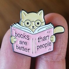 a person is holding a book that says books are better people