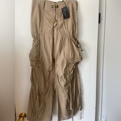 Beautiful Cargo Pants. Gold/Beige/Tan Color. Cotton/Silk Blend. Nwt Bought It A Long Time Ago. Never Worn. It’s Too Small For Me Now Beige Parachute Pants For Spring, Ralph Lauren Summer Pants, Ralph Lauren Straight Leg Bottoms For Summer, Ralph Lauren Wide Leg Bottoms For Spring, Ralph Lauren Straight Leg Spring Bottoms, Ralph Lauren Summer Straight Leg Bottoms, Ralph Lauren Casual Wide Leg Bottoms, Ralph Lauren Wide Leg Pants With Pockets, Ralph Lauren Spring Bottoms With Pockets