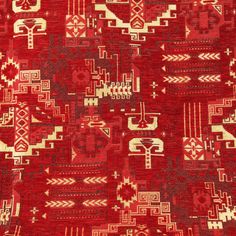 an old red rug with many different designs