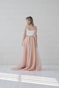 "Default features of this skirt: * It consists 3 tulle layers, fully lined in bridal satin. * Not gathered at the waist, completely flat. * Slim A line silhouette. * Non hand dyeable, but a vast color selection available. * Lining in half circle, wide and flowing. * Features a default train of 16\" or 40cm, can be slightly longer, shorter or none at all. * Tailored satin waistband, 1\" or 2.5cm waistband by default, matches the inner layers of the skirt by default, but can also be done otherwise Emerald Bridesmaids, Minimalist Elopement, Tulle Skirt Pink, Peach Skirt, Tulle Wedding Skirt, Bridal Skirt, Bridesmaid Skirts, Two Piece Wedding Dress, Skirt A Line