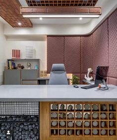 an office with a desk, chairs and shelves