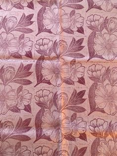 a close up of a cloth with flowers on it