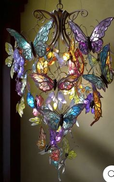 a chandelier made out of stained glass butterflies