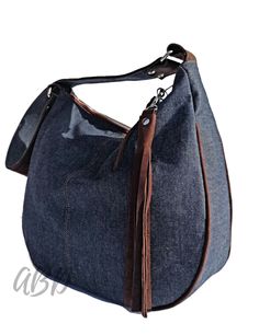 "Denim bag women Handmade denim bag Bag shoulder denim Bag shoulder strap Casual denim bag Everyday denim bag Women shoulder tote Largde bag denim Denim tote bag Large denim tote Handbag shoulder Handbag for women Jeans handbag large FEATURES: designed to be worn over the shoulder inside pocket for mobile ( two large opened ) full zipped up finished with durable cotton lining MATERIALS: denim jeans real leather cotton lining YKK metal zipper silver metal hardware COLORS: Blue Brown DIMENSIONS: Height 12,6\" / 32 cm Width 15˝ / 38 cm Side 5,9\" / 15cm Length of strap 27,8˝ / 70 cm Its one more our product that can be modified and done according to your wishes. You can choose the dimensions,color or decorations of the bag, please contact me and send me what is your desire. If you have any cu Leather Bag Women Handbags, Large Jeans, Unique Leather Bag, Recycled Jeans Bag, Denim Handbag, Denim Shoulder Bag, Large Leather Bag, Jeans Bags, Soft Leather Handbags