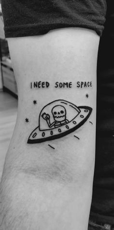 a black and white photo of a tattoo that says i need some space