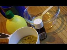 an assortment of spices and condiments sitting on a table next to a measuring cup