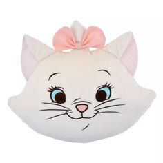 a white cat pillow with a pink bow on it's head and big eyes