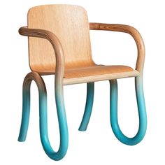 a chair made out of wood and blue paint on the back side, with curved legs