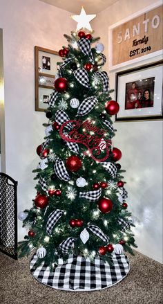 a christmas tree decorated with red, white and black ornaments