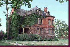 an old brick house covered in ivy