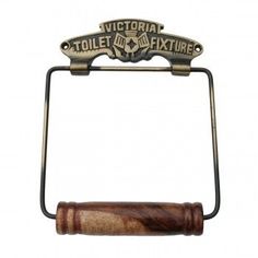 an old fashioned toilet paper holder with a wooden handle