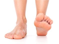 a woman's bare feet are shown against a white background