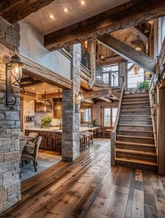 a living room filled with furniture next to a stone wall and wooden floored stairs