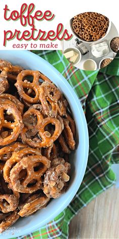 a blue bowl filled with pretzels on top of a green and white towel