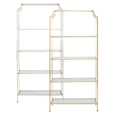 an iron and glass shelving unit with three shelves on each side, one is gold