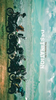 a group of motorcycles parked next to each other in front of the ocean with caption destination