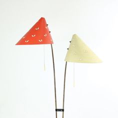 two lamps that are sitting next to each other