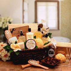 a basket filled with lots of goodies on top of a tiled floor next to a wooden brush