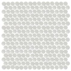 a white tile with circles on the bottom and one circle in the middle, against a white background