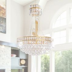 a chandelier hanging from the ceiling in a living room