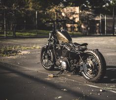 a black motorcycle parked in a parking lot