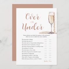 a card with the words over or under written on it and a glass of champagne