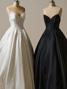 two dresses on mannequins, one in black and the other in white