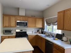 the kitchen is clean and ready for us to use it's new counter tops