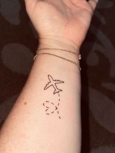 The 90 Most Popular Symbols For Travel Tattoos | Unique & Cute Travel Tattoo Ideas Travel Tattoo Wrist, Minimal Tattoos For Women On Wrist, Wrist Travel Tattoo, Minimal Tattoo Travel, Travel Wrist Tattoos, Cute Airplane Tattoo, Beach Travel Tattoo, Simple Airplane Tattoo, Airplane Tattoos For Women